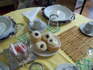 two donuts on a plate on a table at B&B Stupor Mundi in Altamura