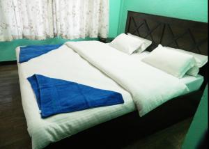 Letto o letti in una camera di Mount Annapurna Guest House