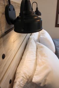 a close up of a light on top of a couch at Cabin 4 at Horse Creek Resort in Rapid City