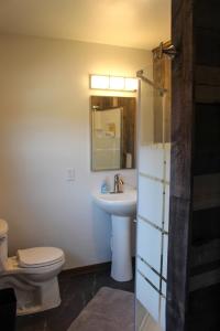 a bathroom with a toilet and a sink at Cabin 4 at Horse Creek Resort in Rapid City