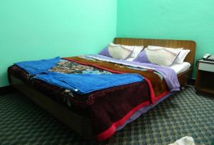 Letto o letti in una camera di Mount Annapurna Guest House