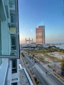 a view from a window of a city street with buildings at Maryam’s House (Lovely Seaview apartment ) in Kuala Terengganu