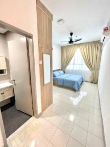 a room with a bedroom with a bed and a door at Maryam’s House (Lovely Seaview apartment ) in Kuala Terengganu