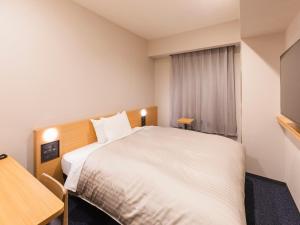 Postel nebo postele na pokoji v ubytování Sotetsu Fresa Inn Daimon + 37 fotografií