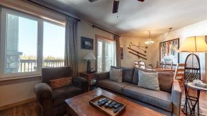 a living room with a couch and a table at Juniper Springs Lodge #539 Condo in Mammoth Lakes