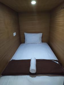 Postel nebo postele na pokoji v ubytování Hastina Hotel Lombok
