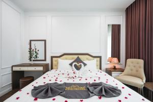 Voodi või voodid majutusasutuse Wind Hotel toas