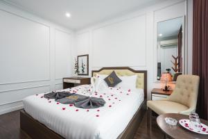 Voodi või voodid majutusasutuse Wind Hotel toas