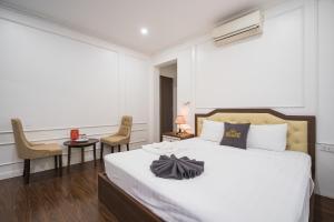 Voodi või voodid majutusasutuse Wind Hotel toas