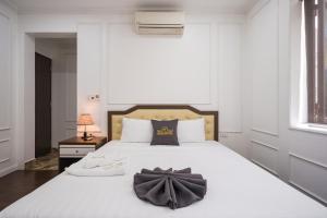 Voodi või voodid majutusasutuse Wind Hotel toas