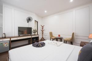 Voodi või voodid majutusasutuse Wind Hotel toas