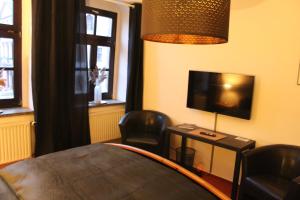 TV a/nebo společenská místnost v ubytování Stadthotel + 20 fotografií