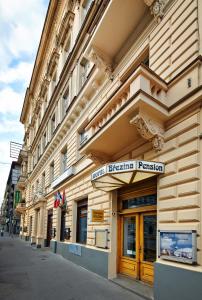 a building with a sign on the side of it at Brezina Pension in Prague