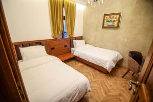 Postel nebo postele na pokoji v ubytování Vila Sonnet
