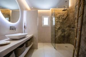 a bathroom with a sink and a shower at Villa Paraga in Platis Gialos +45 photos