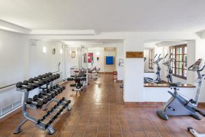 a fitness room with treadmills and machines at Balneario de Fitero - Hotel Bécquer in Fitero
