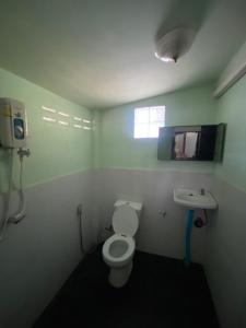 a bathroom with a toilet and a sink at Peace of Love Pai in Pai