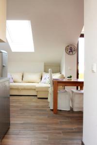 a living room with a couch and a table at Apartment LuVi in Korčula