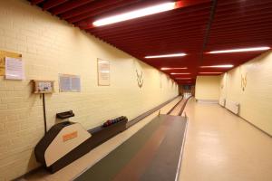 a bowling alley with a lane in a building at Haus Venusberg Jugendbildungsstätte Bonn in Bonn