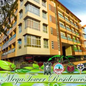 un gran edificio con un cartel delante en Megatower Residence shortwalk2 SM BAGUIO BURNHAM, en Baguio