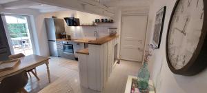 a kitchen with a sink and a counter top at Ferienwohnungen Marienweiher in Marktleugast