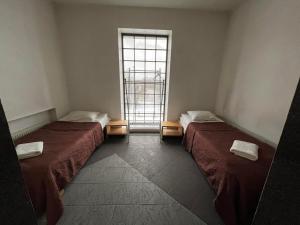 Postel nebo postele na pokoji v ubytování Majaka Hostel