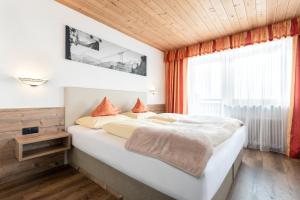 Letto o letti in una camera di Gasthof Pension Berghof