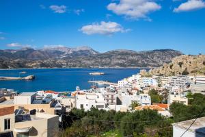 a view of a city and a body of water at Divine Apartment in Karpathos