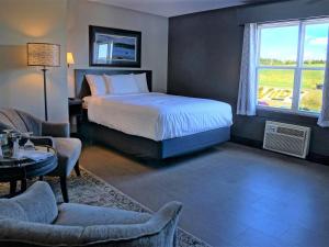 A bed or beds in a room at The Wilds at Salmonier River