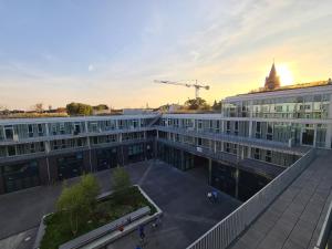 an overhead view of a building with a crane in the background at KONCEPT HOTEL Josefine in Cologne