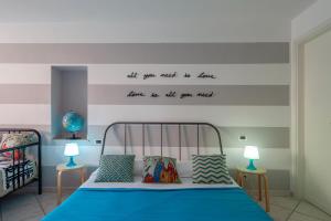 Postel nebo postele na pokoji v ubytování Ciao Bella COLORS