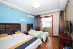 Una cama o camas en una habitación de One Meter Sunshine Hotel Xi'an Xianyang International Airport Flagship Store