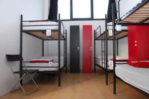 a room with four bunk beds in a room at Bilbao Akelarre Hostel in Bilbao