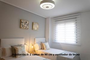Posteľ alebo postele v izbe v ubytovaní Arrecife 3 dormitorios