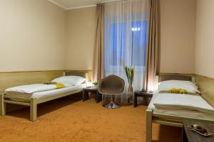 Voodi või voodid majutusasutuse Hotel Lužnice toas