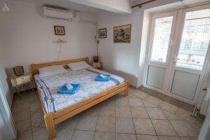 Postel nebo postele na pokoji v ubytování Villa Goga