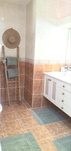 a bathroom with a sink and a chair in it at La Dolce Vita Opio in Opio +28 photos