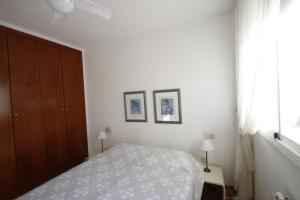 Posteľ alebo postele v izbe v ubytovaní Apartamento Les Palmeres