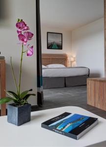Postel nebo postele na pokoji v ubytování Hotel Carre Noir