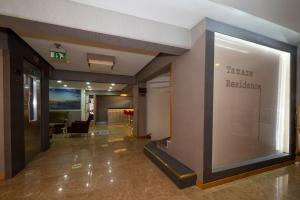 a lobby of a building with a sign that reads healing healthcare at Tamara Residence in Istanbul