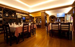a dining room with tables and chairs in a restaurant at Ocean Gardens in Funchal