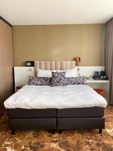 Ένα ή περισσότερα κρεβάτια σε δωμάτιο στο Boutique Hotel Jersey