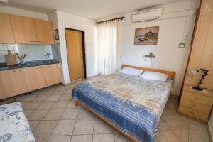 Postel nebo postele na pokoji v ubytování Villa Goga