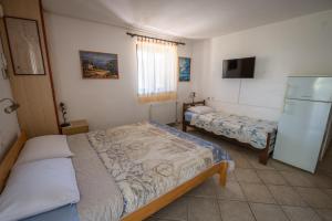 Postel nebo postele na pokoji v ubytování Villa Goga