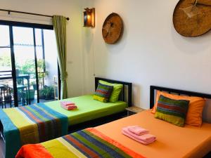 Voodi või voodid majutusasutuse Mae-Sa-Riang Home toas