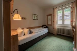 Voodi või voodid majutusasutuse Grüner Baum Naturparkhotel & Schwarzwald-Restaurant toas
