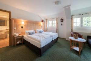 Voodi või voodid majutusasutuse Grüner Baum Naturparkhotel & Schwarzwald-Restaurant toas