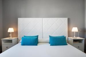 Postel nebo postele na pokoji v ubytování Apartamentos La Estrella iii