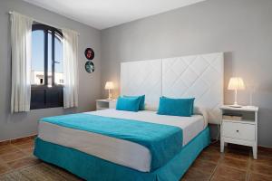 Postel nebo postele na pokoji v ubytování Apartamentos La Estrella iii