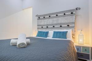 A bed or beds in a room at Minimalismo de Vanguardia con altas calidades 1 BR